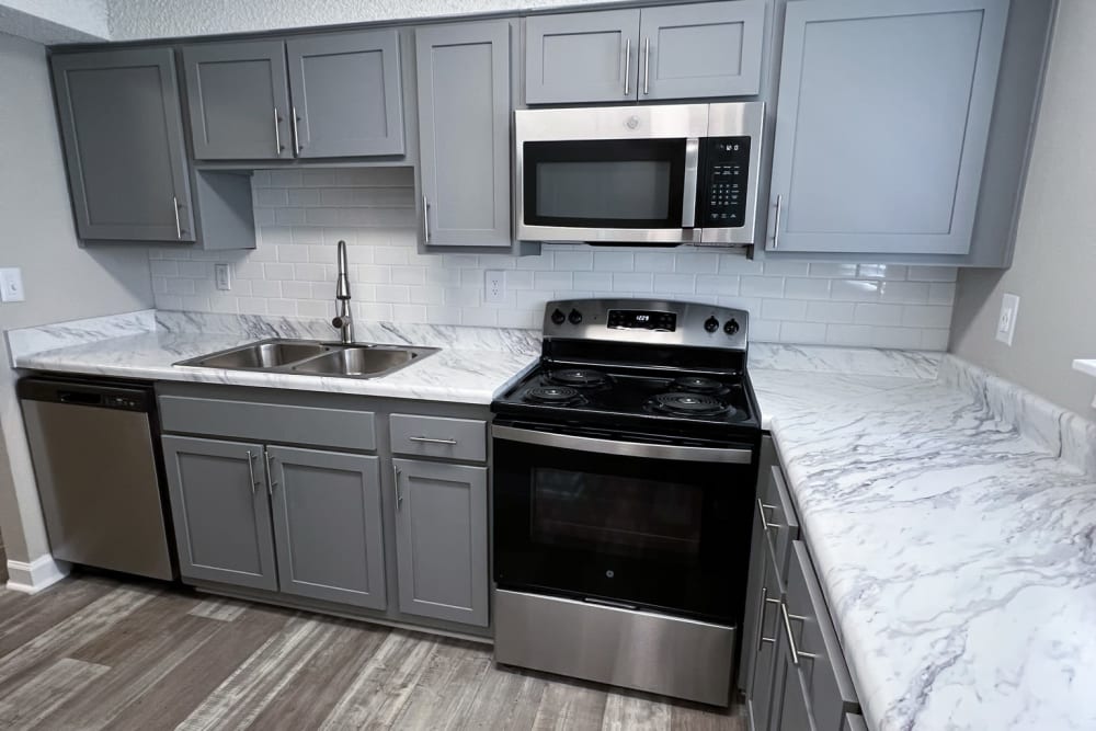 Stainless-steel appliances in an apartment kitchen at Pinewood Station in Hillsborough, North Carolina
