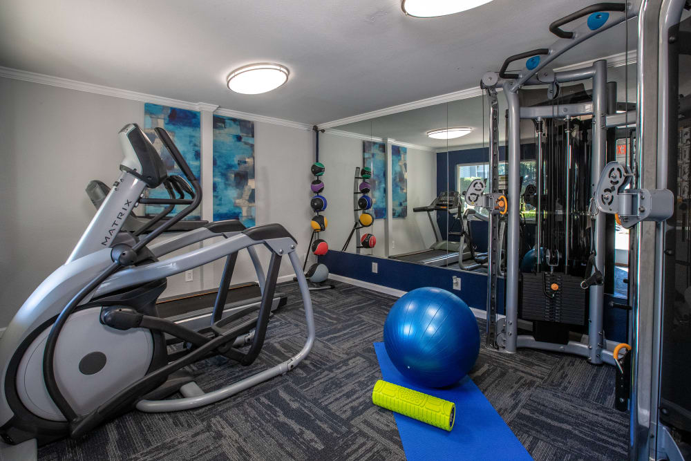 Workout equipment in the on-site fitness center at Pinewood Station in Hillsborough, North Carolina
