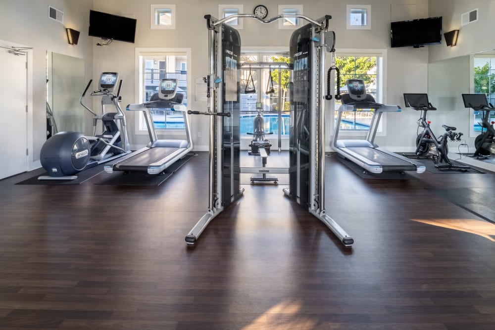 fitness center with weights at The Kensington in Pleasanton, California