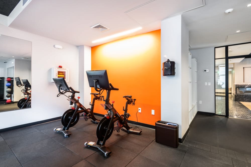 Fitness studio with stationary bikes at One India Street Apartments in Boston, Massachusetts