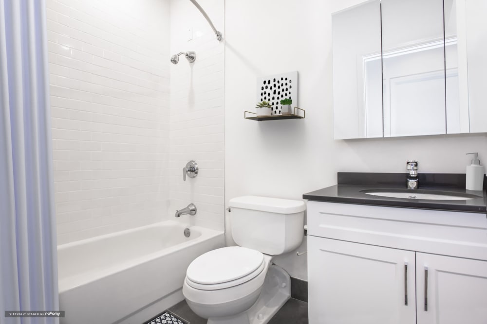 Full apartment bathroom with shower/tub and toilet at One India Street Apartments in Boston, Massachusetts