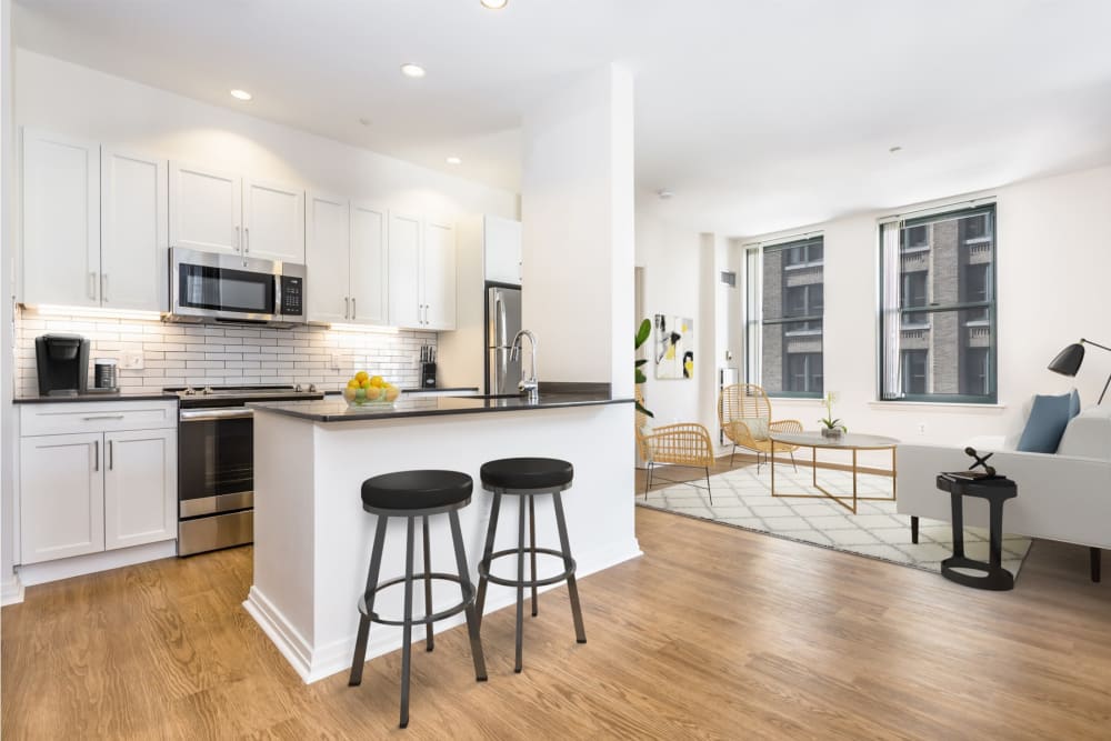 Spacious open concept apartment with eat-in kitchen and city views at One India Street Apartments in Boston, Massachusetts