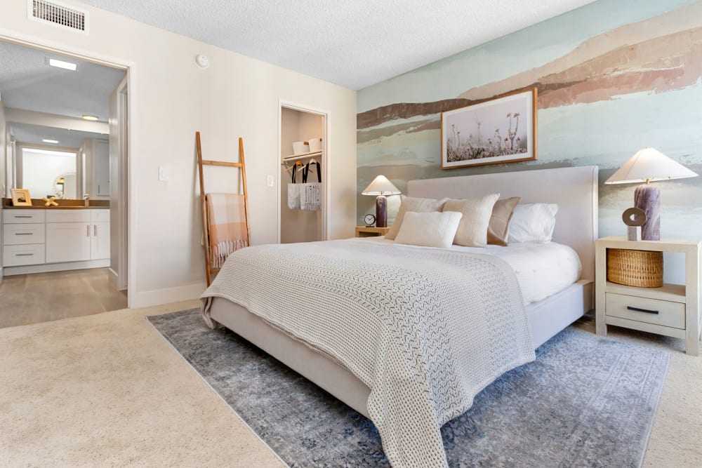 Spacious bedroom with plush carpeting in a model home at The Villas at Woodland Hills in Woodland Hills, California 