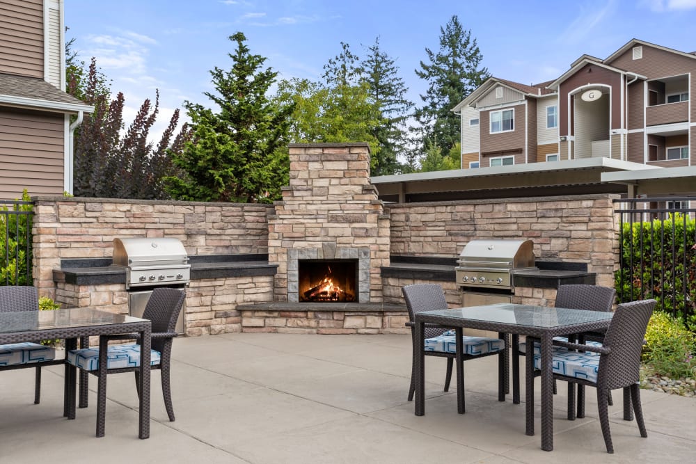 Outdoor chairs and tables at Woodland Apartments in Olympia, Washington