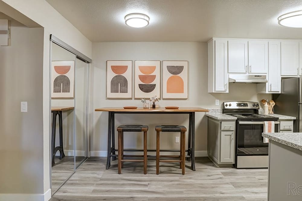 Kitchen with dinning table at Austin Commons Apartments in Hayward, California