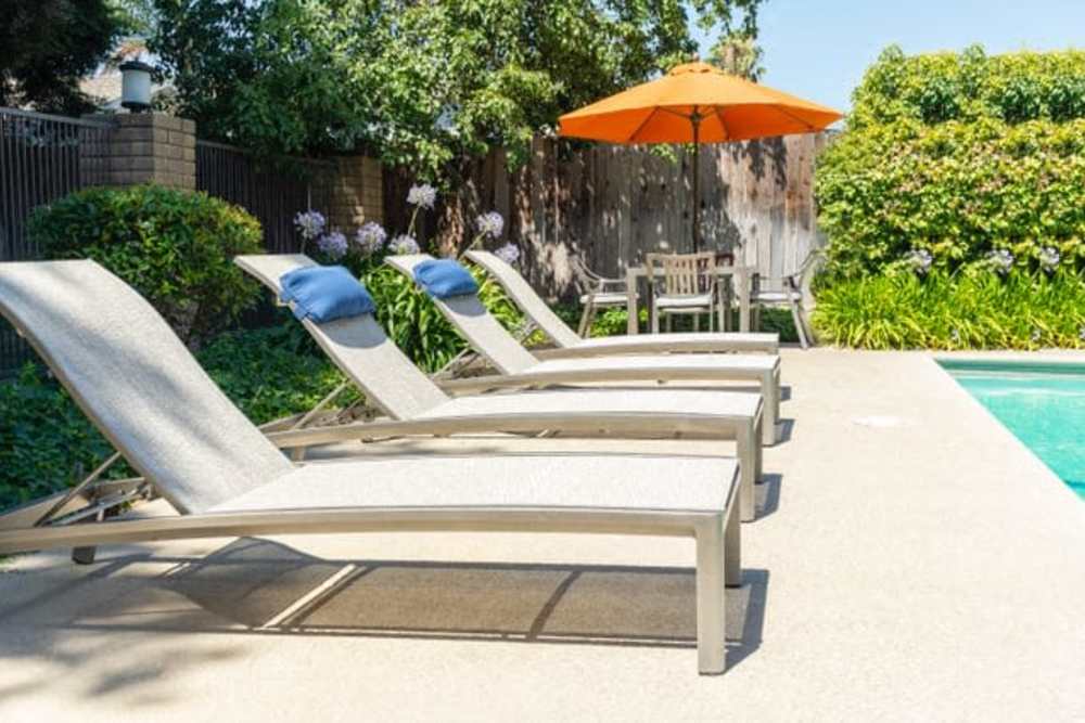 Relax by the pool at Walnut Woods in Turlock, California