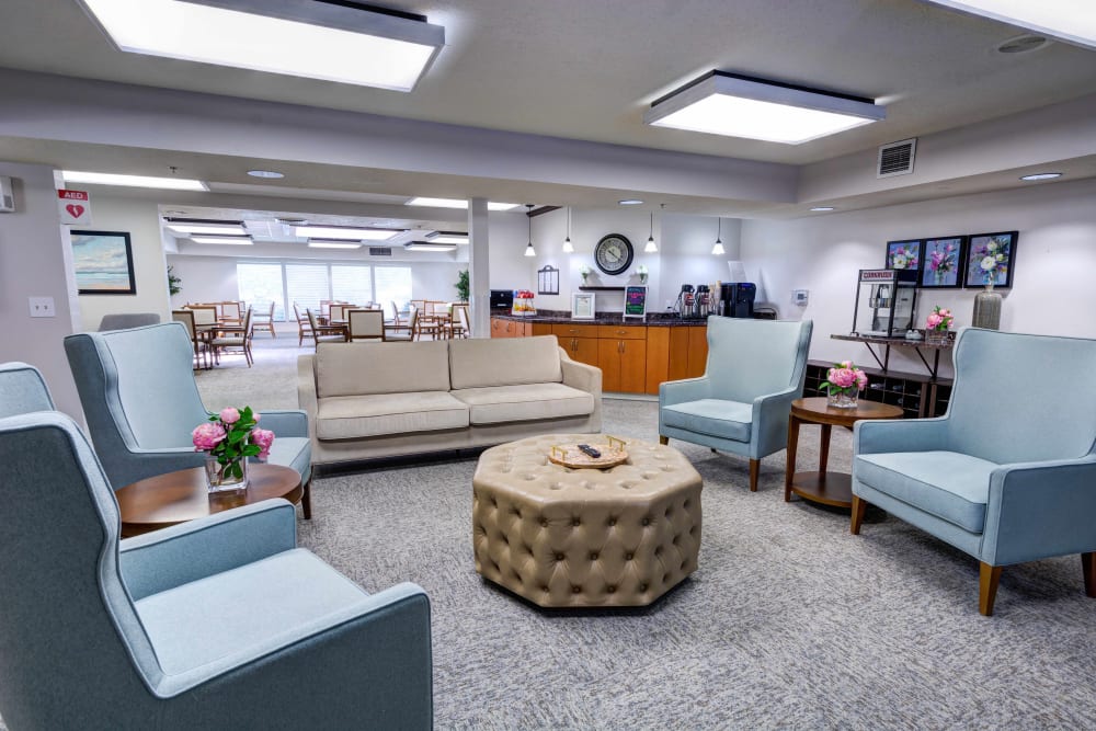 Armchairs, sofa and popcorn machine in the community room at Silver Creek Senior Living in Woodburn, Oregon