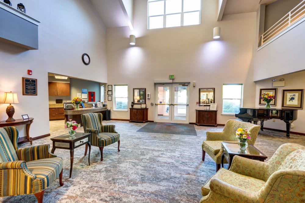 Common room with a grand piano at The Suites Assisted Living and Memory Care in Grants Pass, Oregon