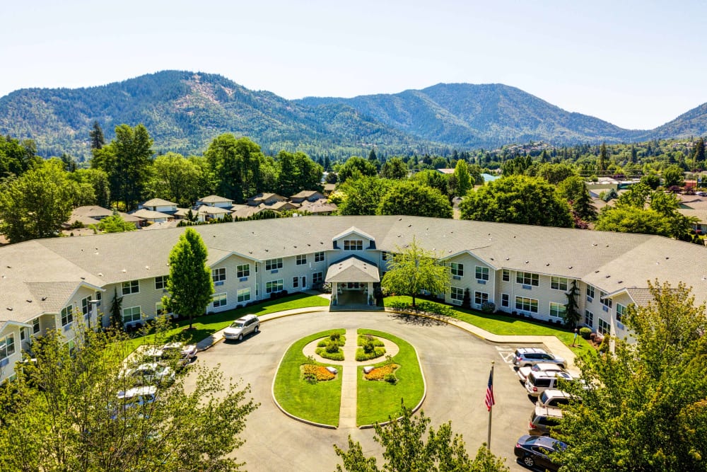 Aerial view of The Suites Assisted Living and Memory Care and the surrounding hills in Grants Pass, Oregon