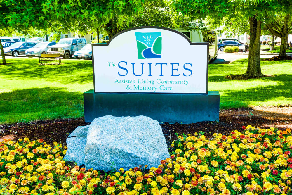 Sign and beautifully landscaped flowers at The Suites Assisted Living and Memory Care in Grants Pass, Oregon