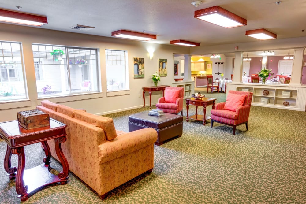 Sitting area with a sofa and armchairs at Timberwood Court Memory Care in Albany, Oregon