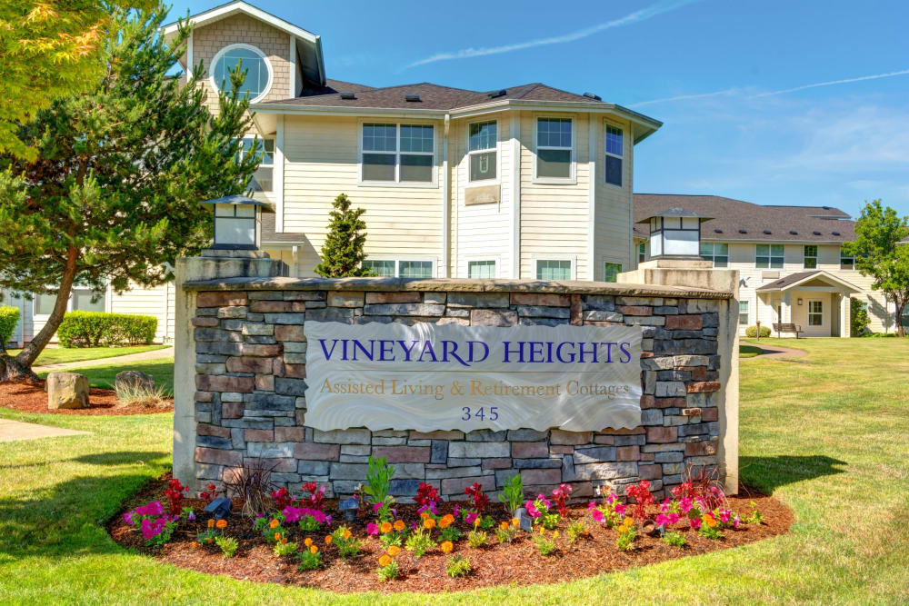 Sign and main building exterior at Vineyard Heights Assisted Living in McMinnville, Oregon