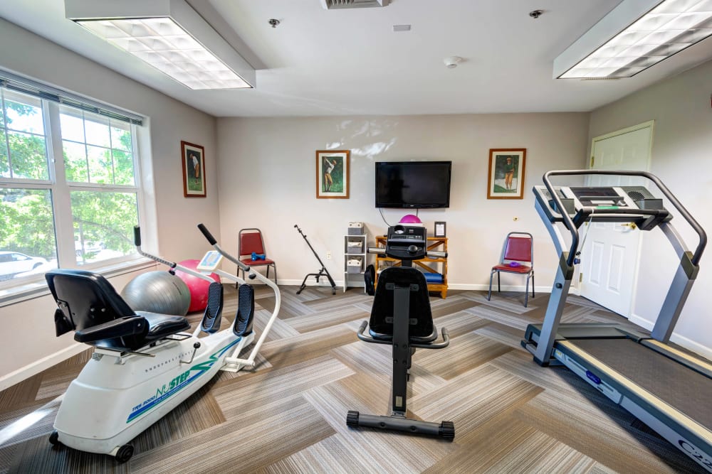 Fitness center with treadmill and low-impact cardio machines at Vineyard Heights Assisted Living in McMinnville, Oregon