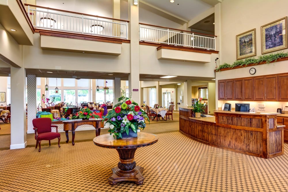 Front desk and lobby with cathedral ceilings at Vineyard Heights Assisted Living in McMinnville, Oregon