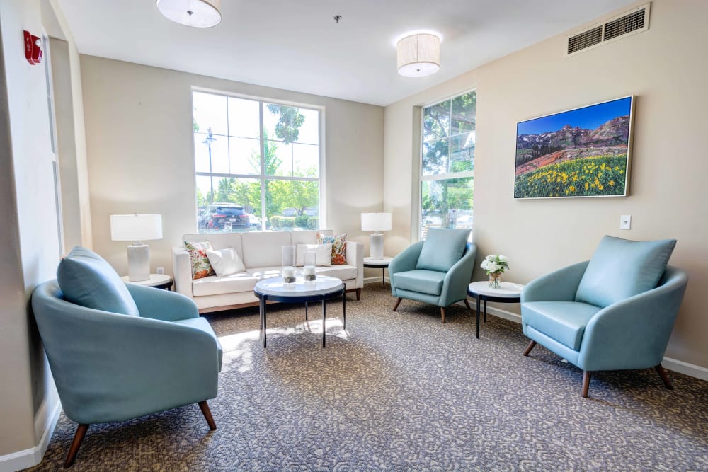 Sitting area with a sofa and armchairs at Vineyard Heights Assisted Living in McMinnville, Oregon