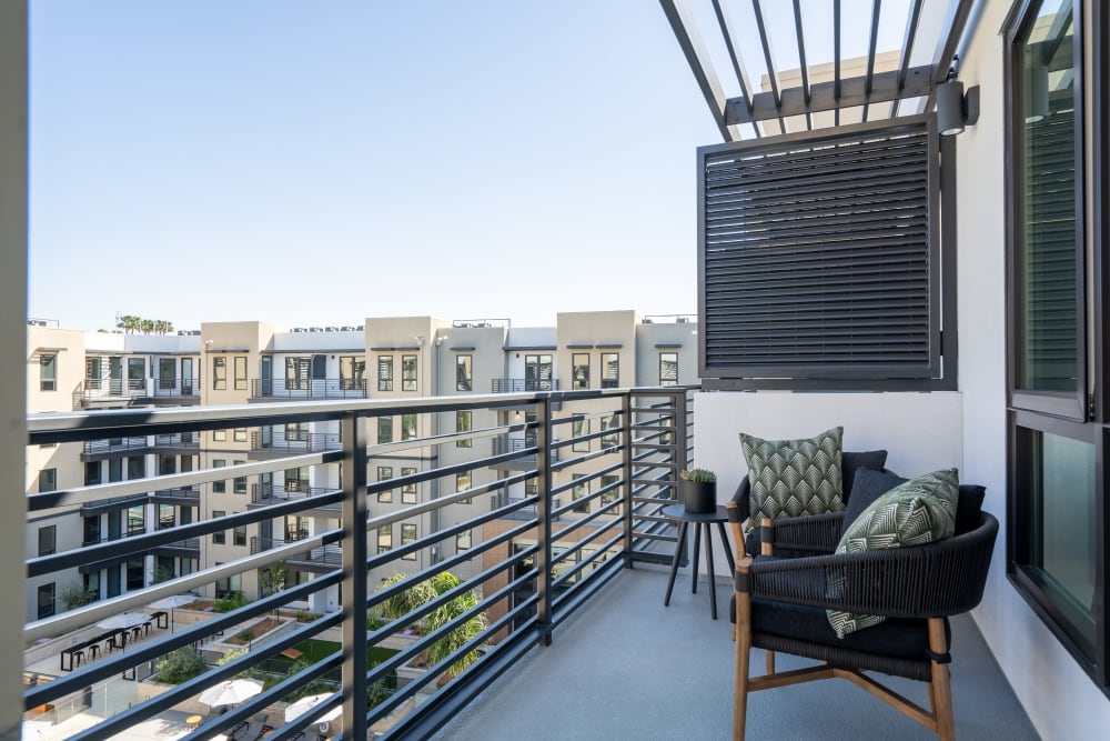 Large private balcony overlooking the courtyard at MV Apartments in Mountain View, California