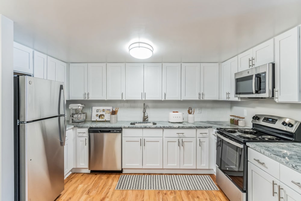 Modern kitchen  with wooden floorat Eagle Rock Apartments at Swampscott in Swampscott, Massachusetts