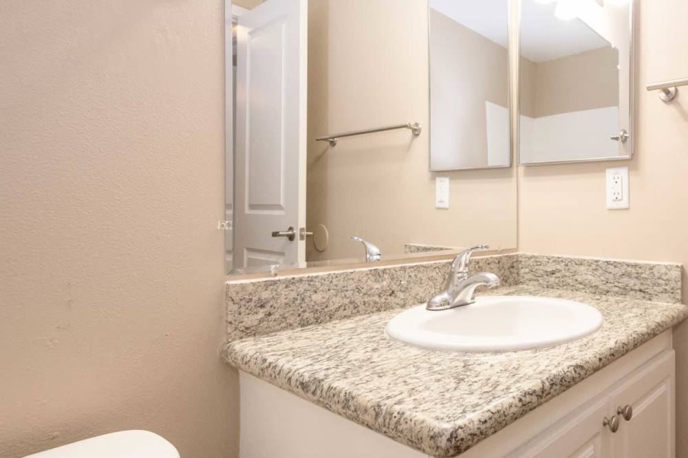 Bathroom with mirror at The Meridian Apartment Homes in Walnut Creek, California