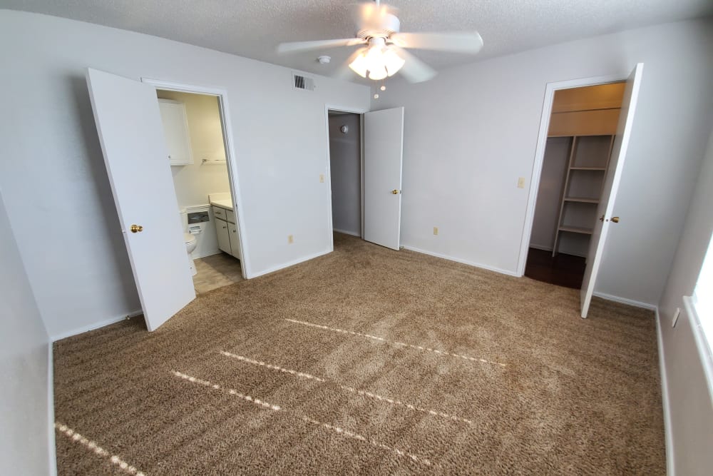 Model apartment master bedroom with carpeted floor angle 2 at Pickwick Place in Oklahoma City, Oklahoma