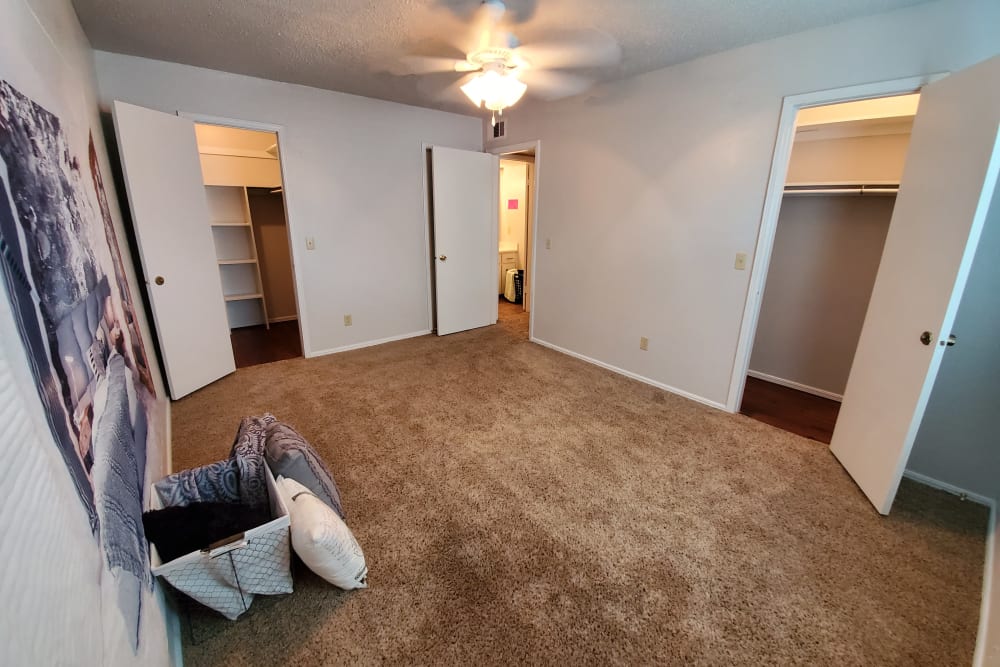 Model apartment master bedroom with carpeted floor at Pickwick Place in Oklahoma City, Oklahoma