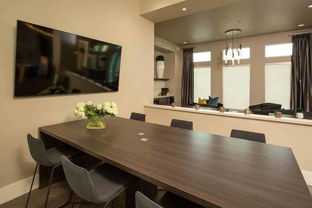 Conference room with TV at Allure Apartments in Modesto, California