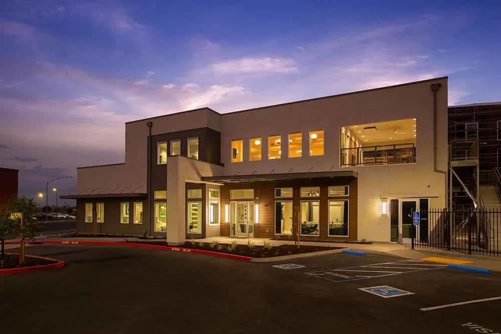 A nighttime view of an external building at Allure Apartments in Modesto, California