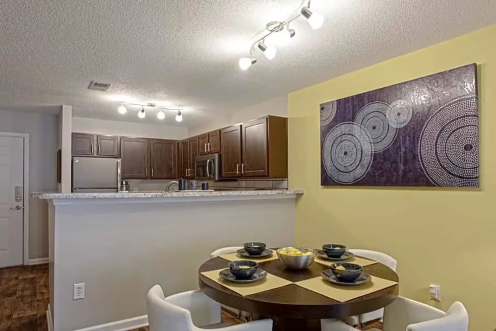 Dining area and kitchen of a model home at The Park at Aventino in Greensboro, North Carolina