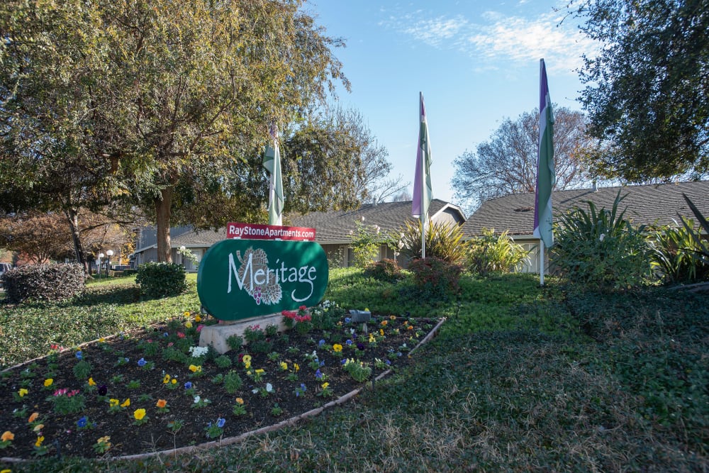 Entrance sign and landscaping at Meritage Apartments in Lodi, California