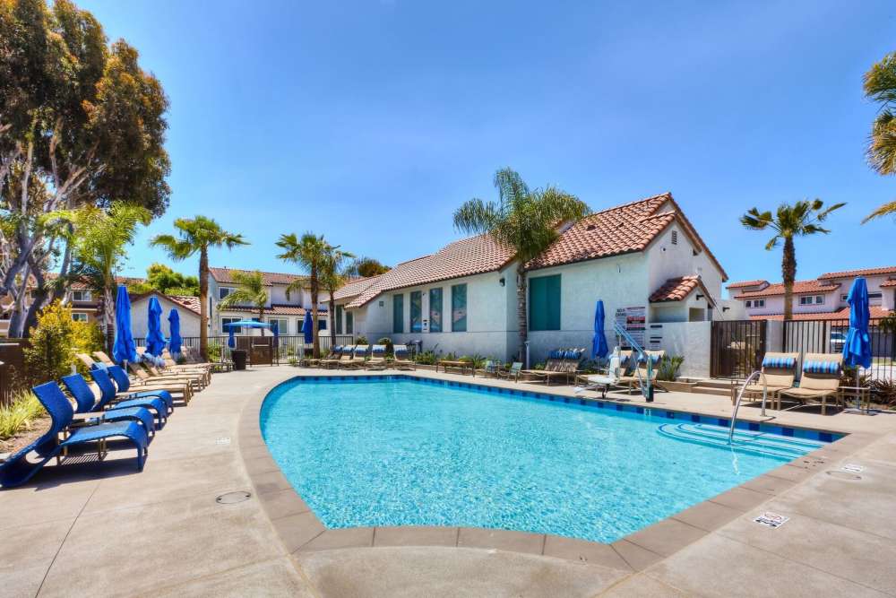 Swimming pool with sun loungers at Surfside Villas in Huntington Beach, California