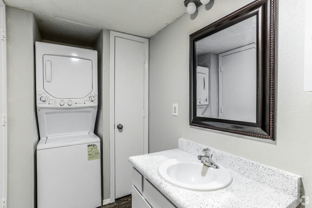 bathroom with stackable washer and dryer at at Midwest City Depot in Midwest City, Oklahoma