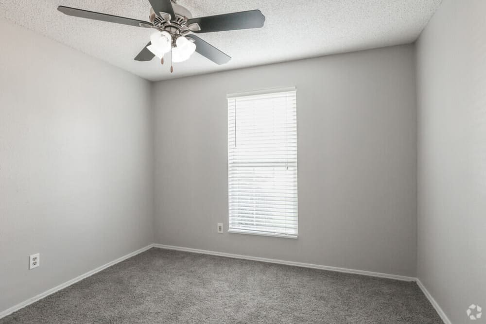 Bedroom with window and ceiling fan at Midwest City Depot in Midwest City, Oklahoma
