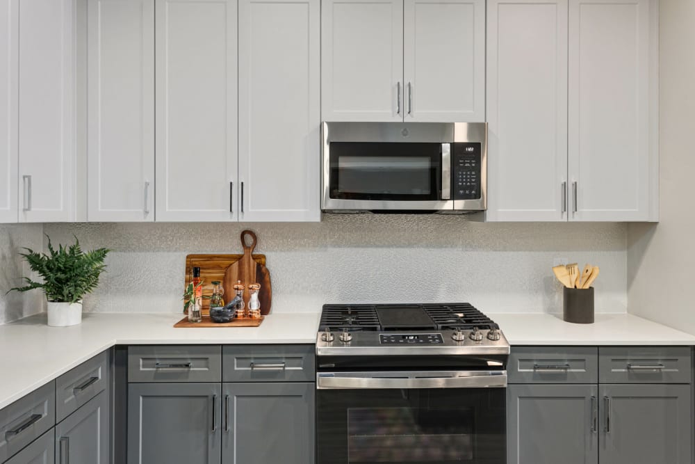 Kitchen with stainless-steel appliances at Olympus Chandler at the Park in Chandler, Arizona