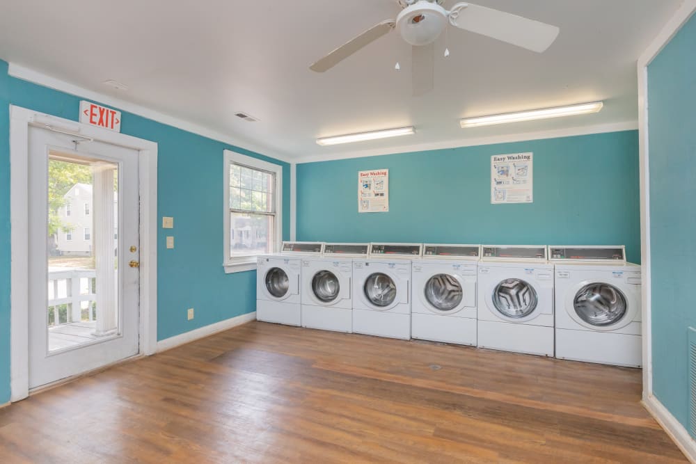 A row of washers in the community laundry room at Cottage Grove Apartments in Newport News, Virginia