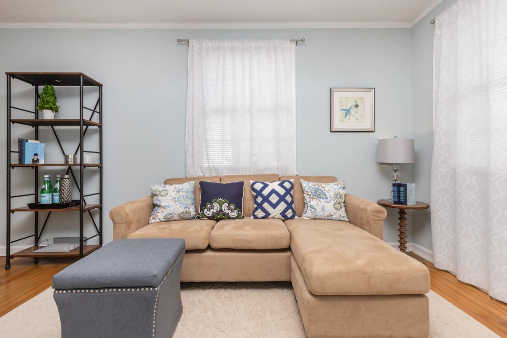 A furnished apartment living room at Cottage Grove Apartments in Newport News, Virginia