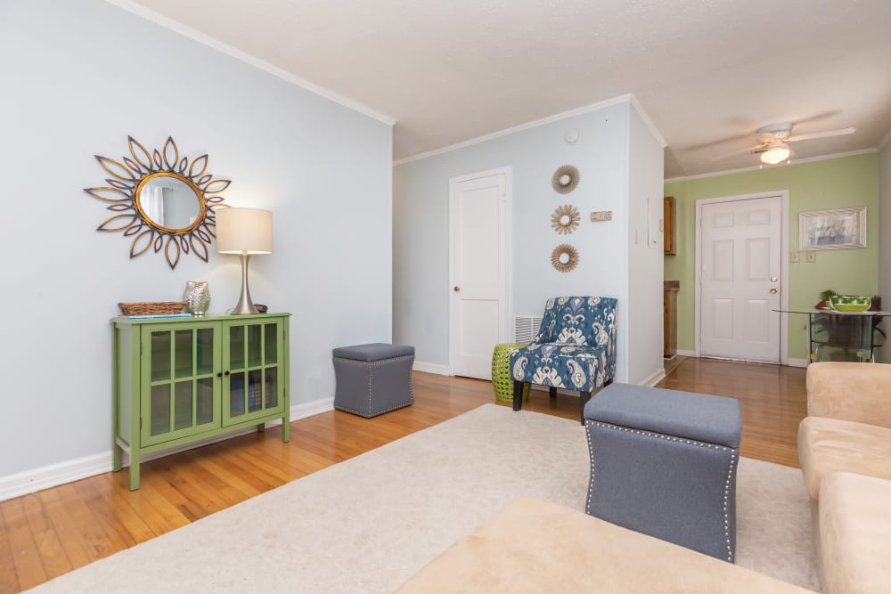 Wood flooring in an apartment entryway and living room at Cottage Grove Apartments in Newport News, Virginia