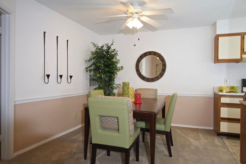 A dining table and chairs in a model apartment at Royal Pointe in Virginia Beach, Virginia