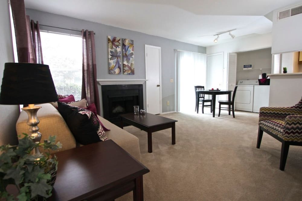 A spacious apartment living room and laundry room at Royal Pointe in Virginia Beach, Virginia