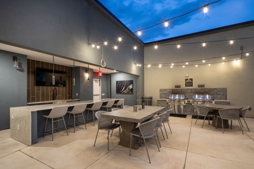 Outdoor kitchen and lounge at Olympus Chandler at the Park in Chandler, Arizona