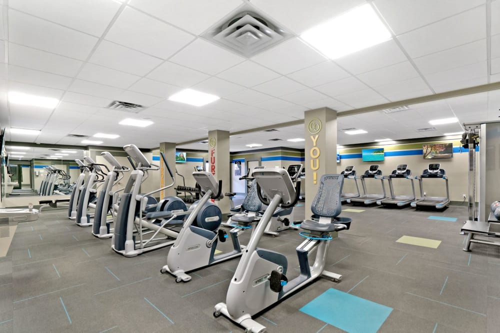 Fitness center with equipment at Canterbury Green in Fort Wayne, Indiana