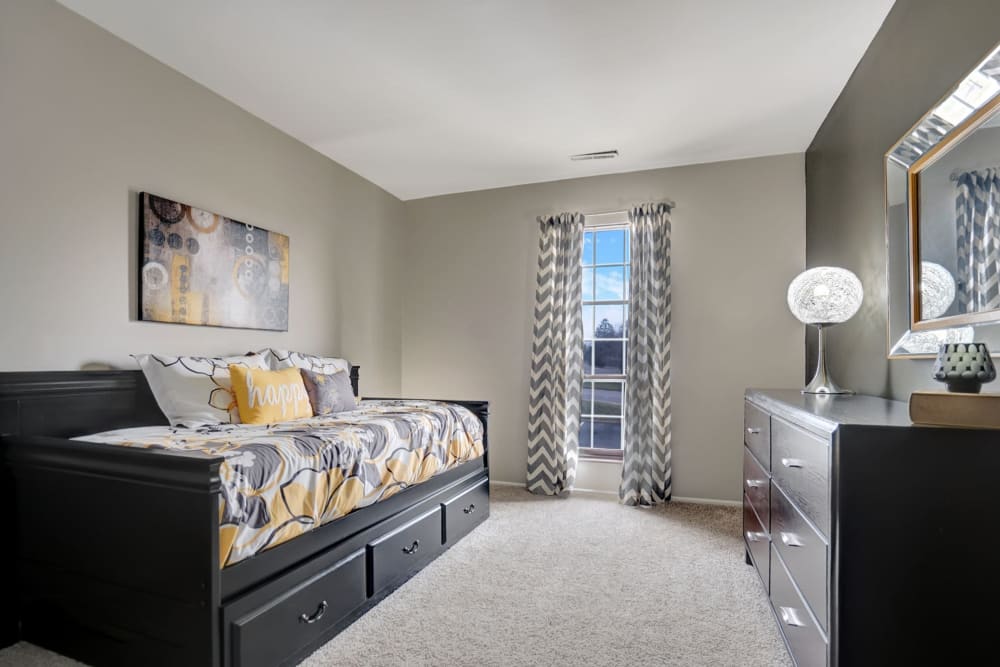 Bedroom with curtains at Canterbury Green in Fort Wayne, Indiana