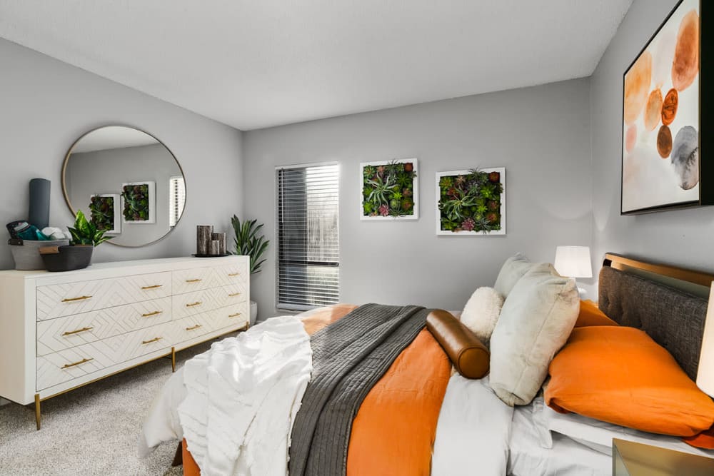 Modern Apartments with a Bedroom and plants in the wall at Aurella Cary in Cary, North Carolina