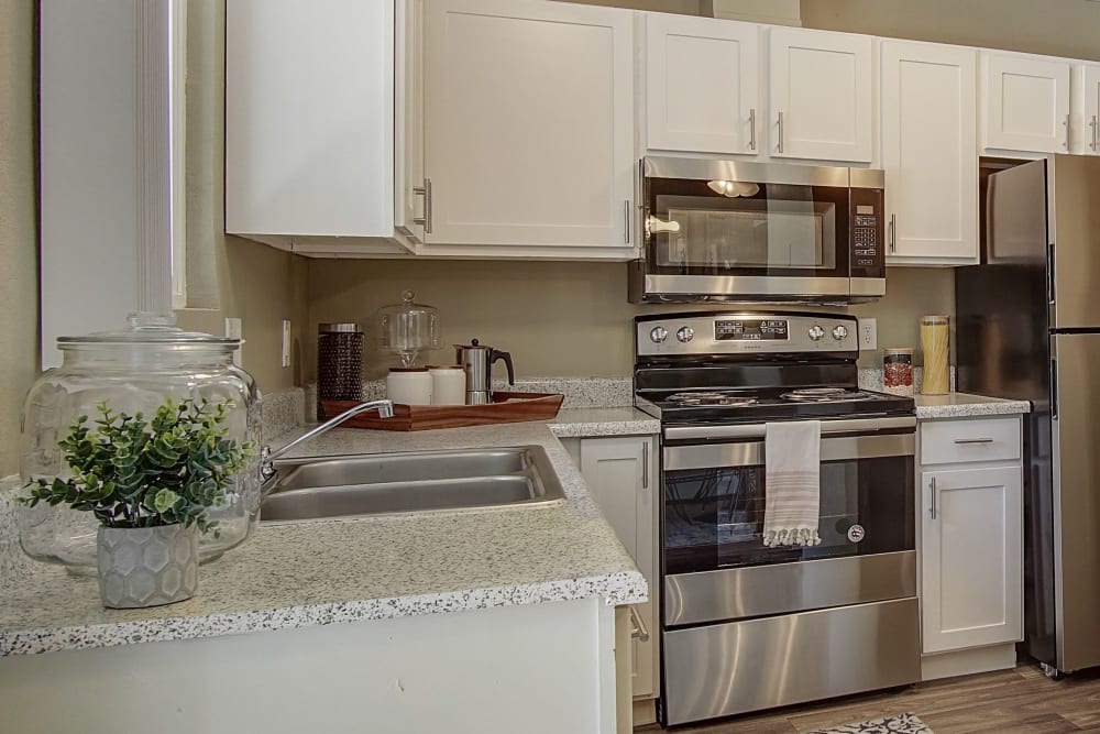 Model kitchen with light accents at Marina's Edge Apartment Homes in Sparks, Nevada