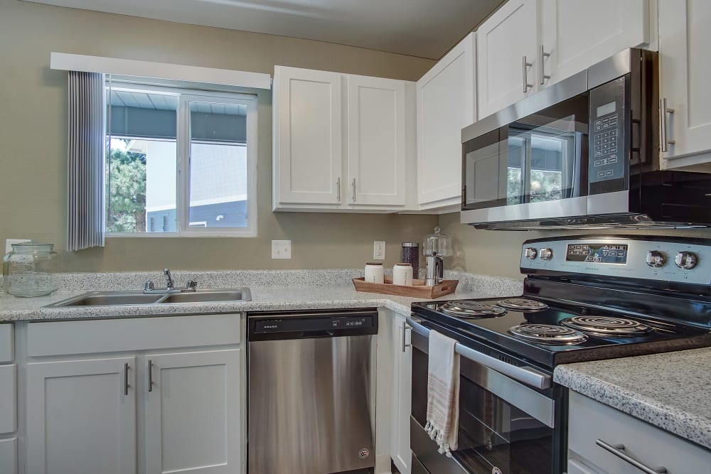 Kitchen with white cabinets at Marina's Edge Apartment Homes in Sparks, Nevada