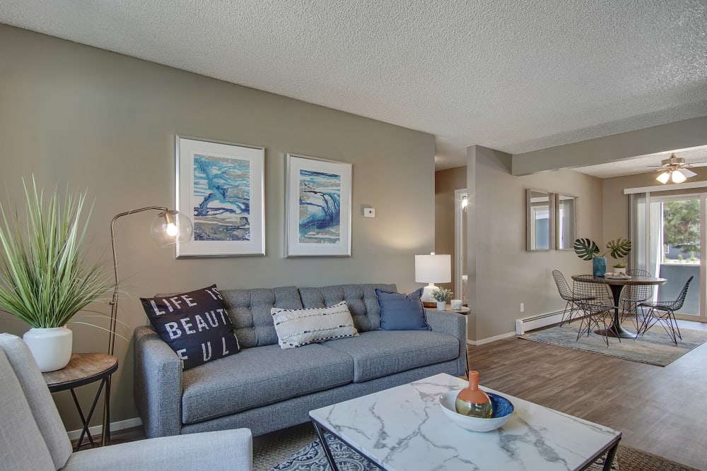 Living space with gray couches at Marina's Edge Apartment Homes in Sparks, Nevada