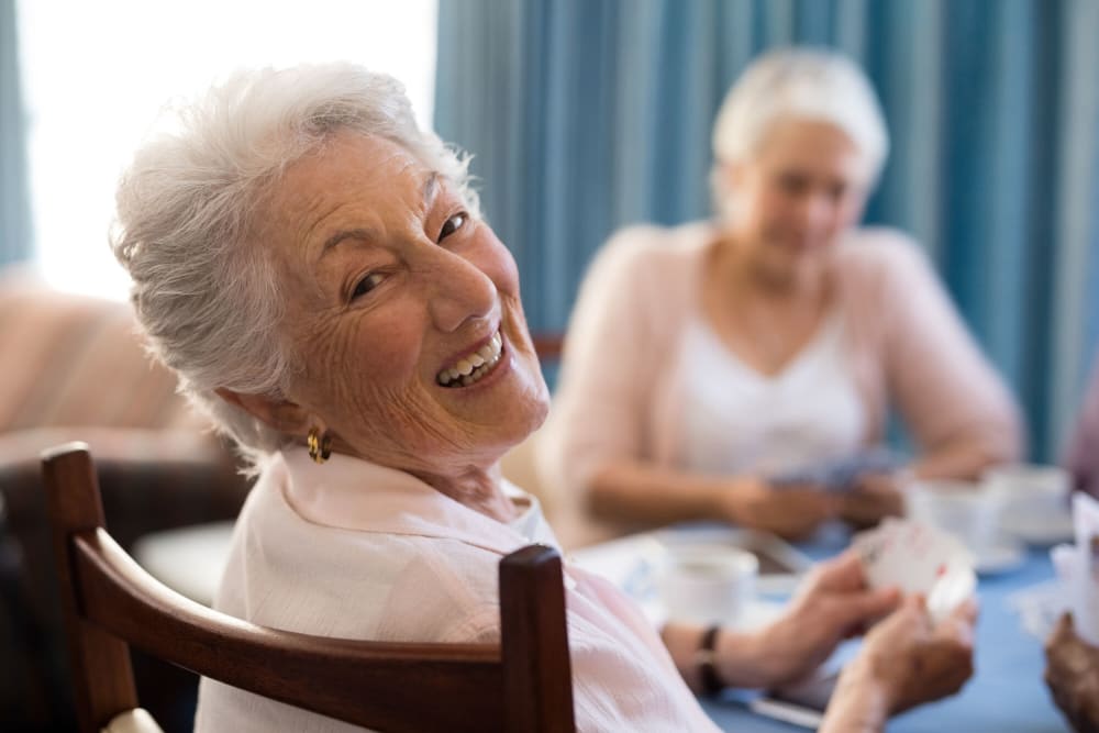 Residents playing cards at Harbor Cove Memory Care in Hilton Head Island, South Carolina