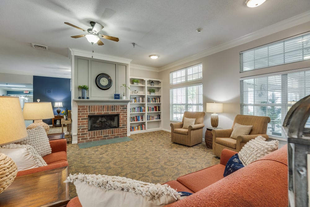 Fireside seating in a lounge for residents at Village Cove Assisted Living in Hilton Head Island, South Carolina