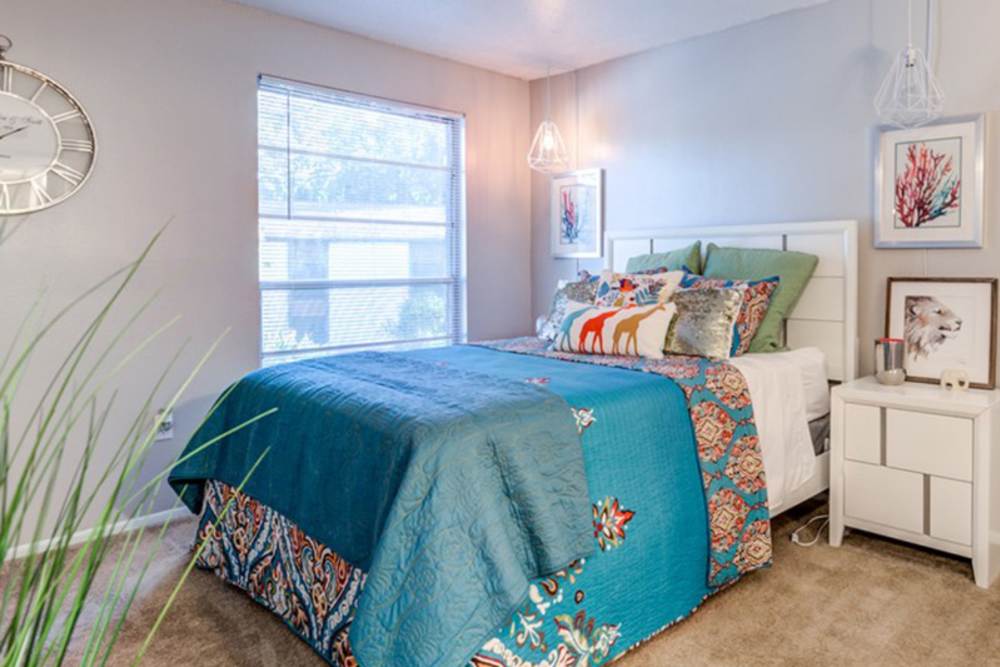 Model apartment bedroom with a twin bed in it at Acasă Ocala in Tallahassee, Florida
