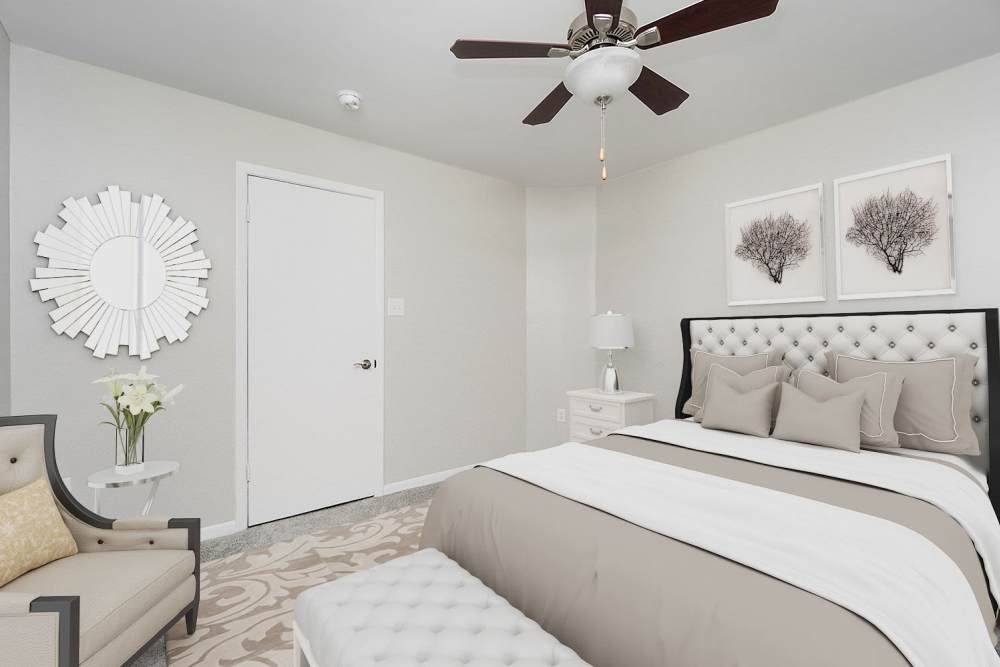 Model apartment bedroom at Acasă Orchard Park Apartments in Greenville, South Carolina