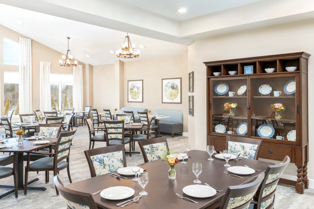 Dining Area with Elegant Chairs and Tables at {location_name}} in West Milton, Ohio