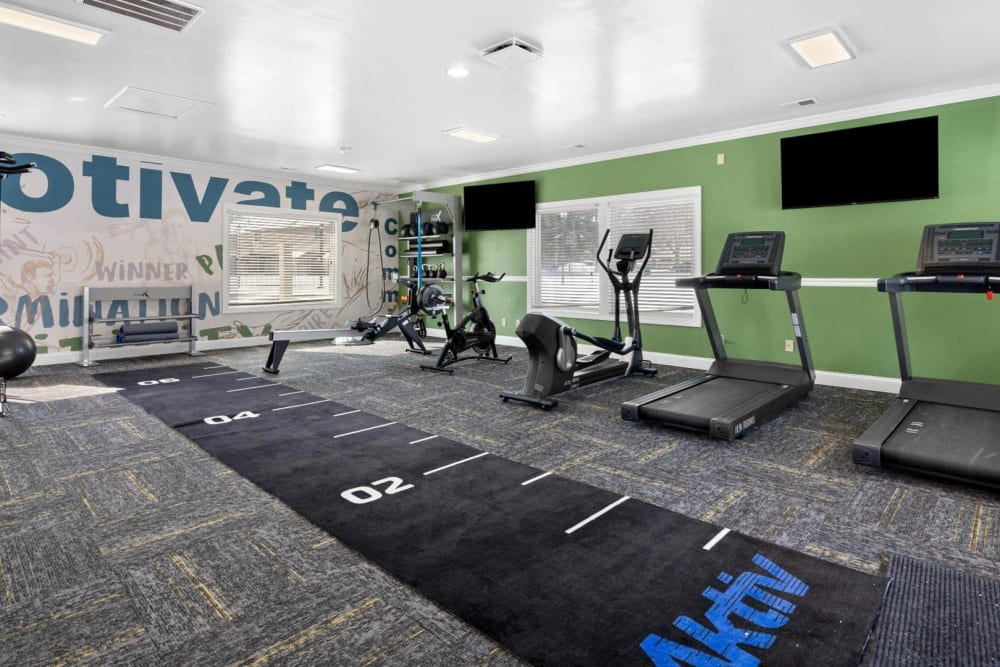Fitness center with treadmills at Woodbridge Apartments in Fort Wayne, Indiana